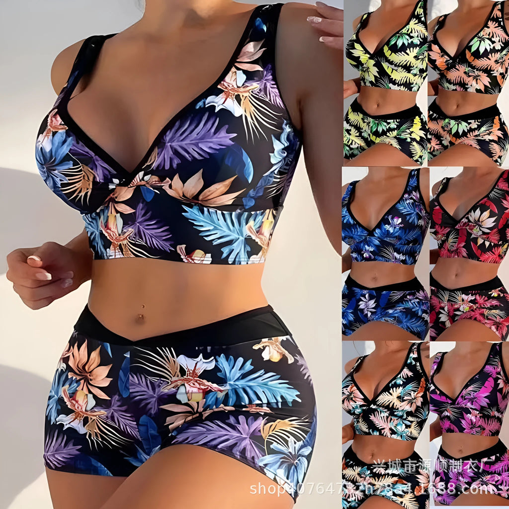 Women's two-piece swimsuit set with sleeveless top and printed boxer-style bottoms in a multi-colour pattern.