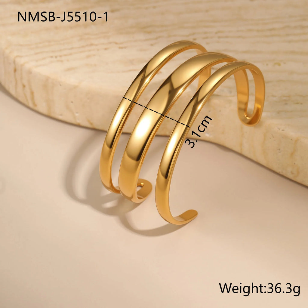 Stainless steel geometric line bracelet with simple opening clasp in gold or steel finish