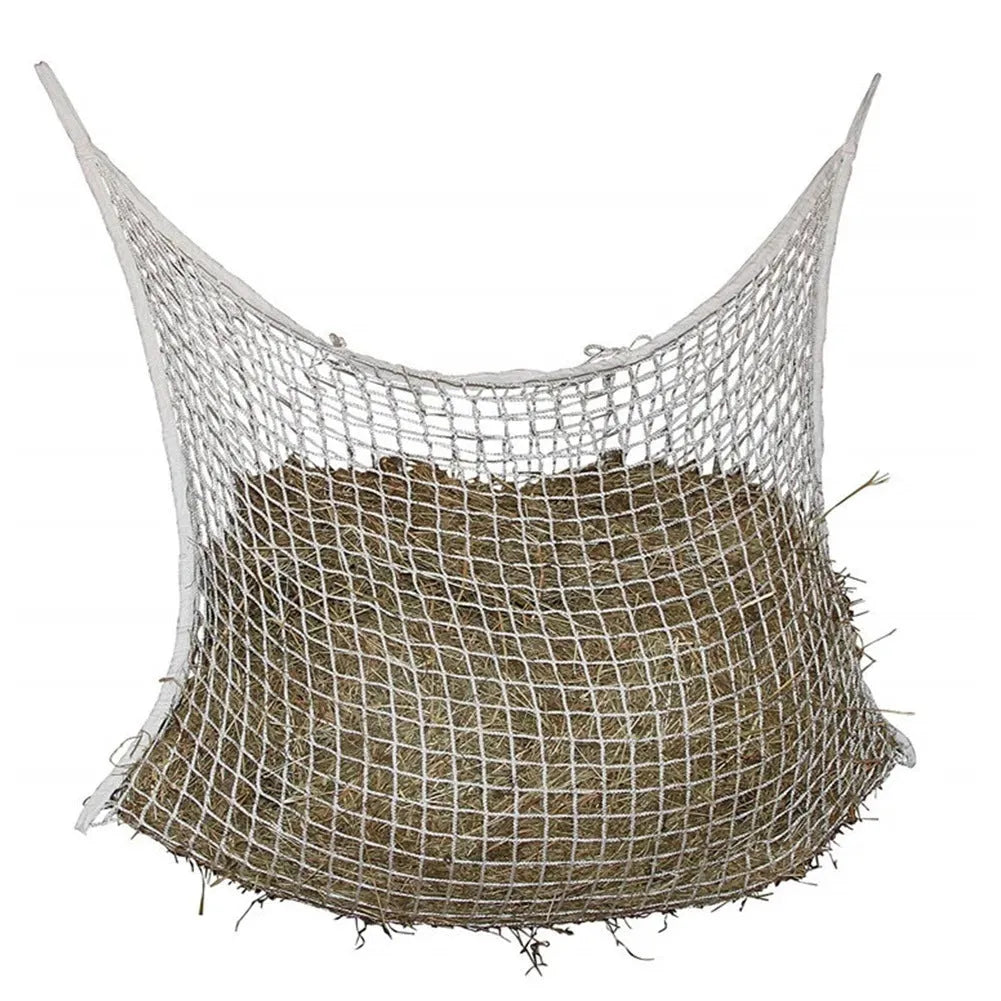 Woven PE rope mesh horse feeding bag hanging with hay inside, black colour shown