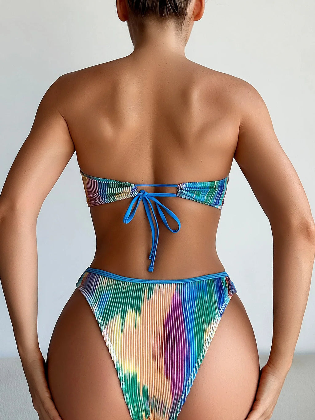 Colour printed strapless tube top bikini set with matching briefs on a mannequin.