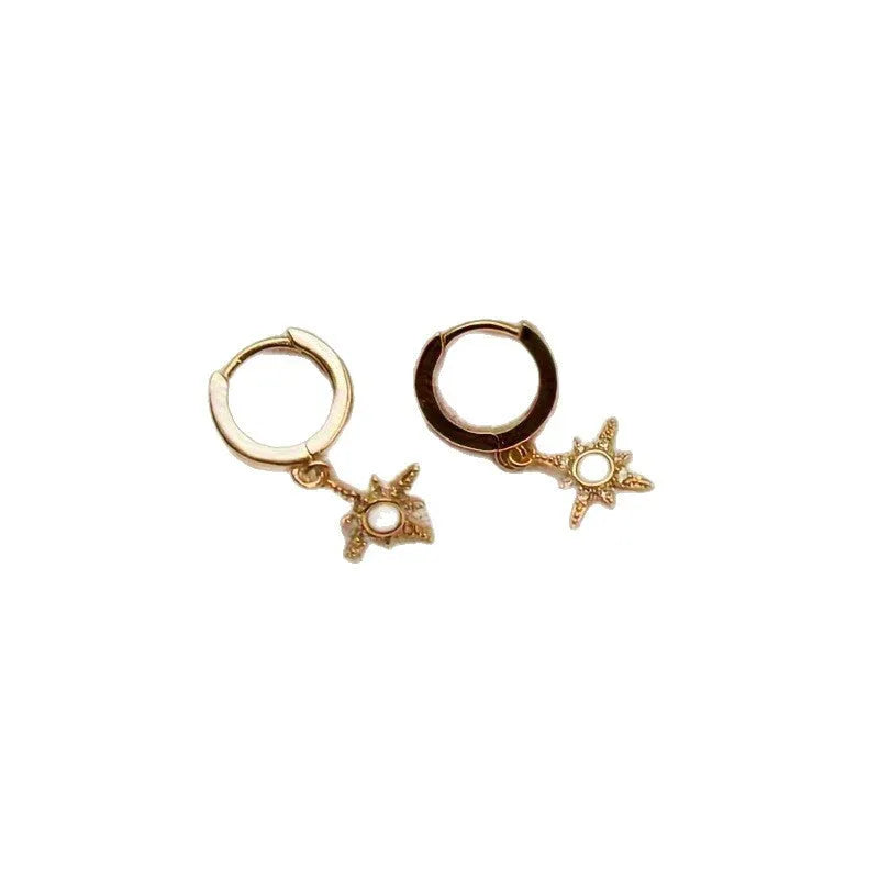 Gold copper eight-pointed star opal stud earrings on a white background