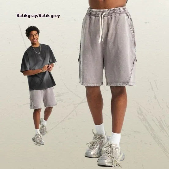 Men's loose-fit pure cotton terry shorts in a batik grey colour, showing street fashion style.