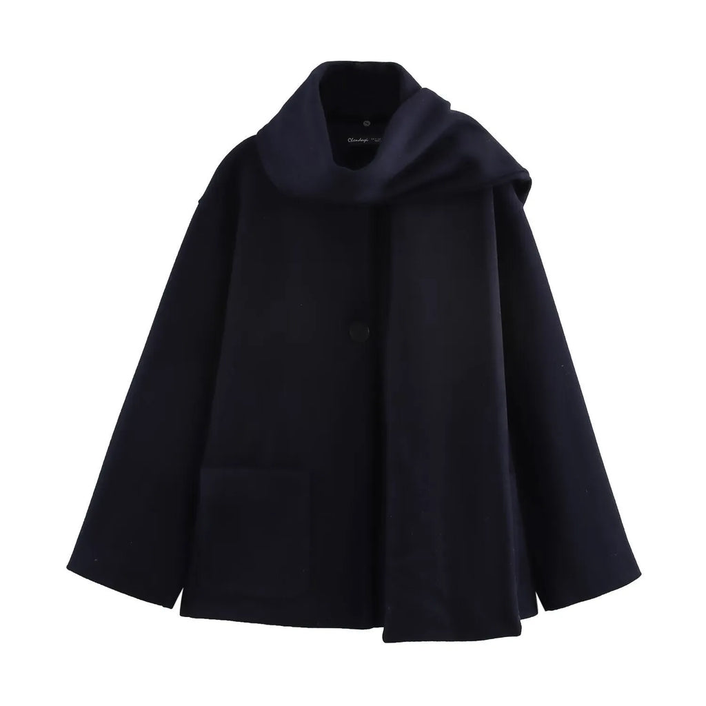 Women's long grey polyester coat with a thick artificial fur collar and pockets.