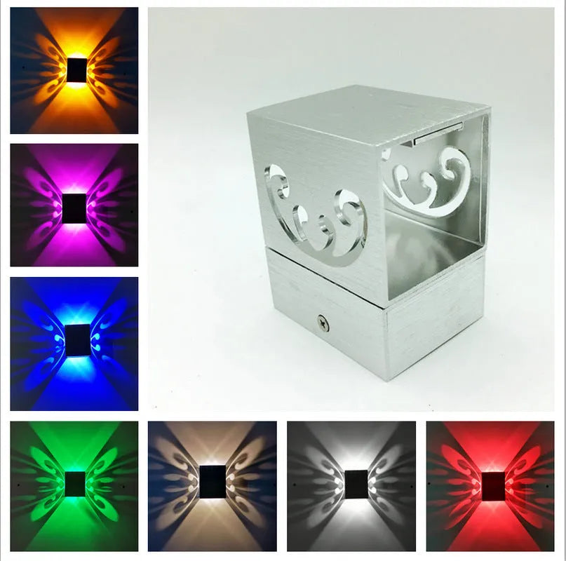 Modern aluminium LED butterfly wall lamp with remote control for seven colour options on interior wall