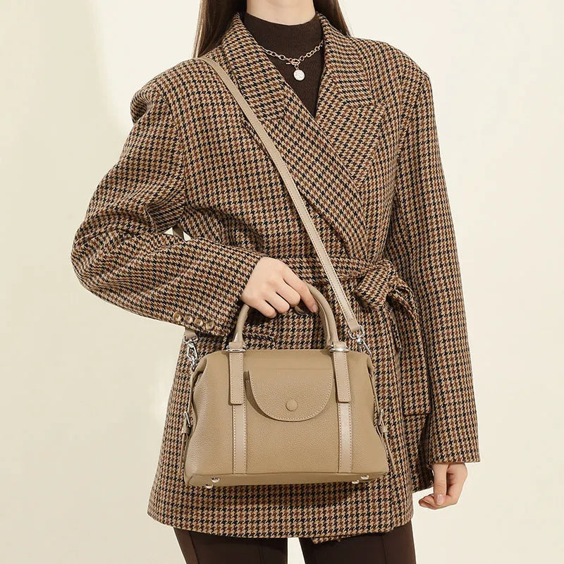Genuine leather ladies handbag with combination lock and single strap in street trend style