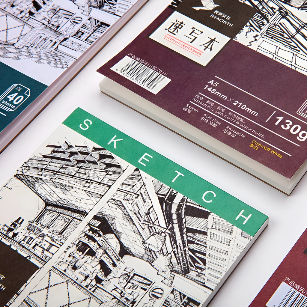 A4 sketch book with coil binding showing lay-flat pages, available in multiple paper weights and sizes for drawing