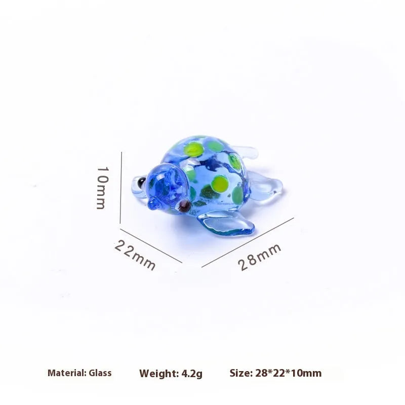 Geometric glass turtle desktop ornament in modern simplicity style on a wooden surface.