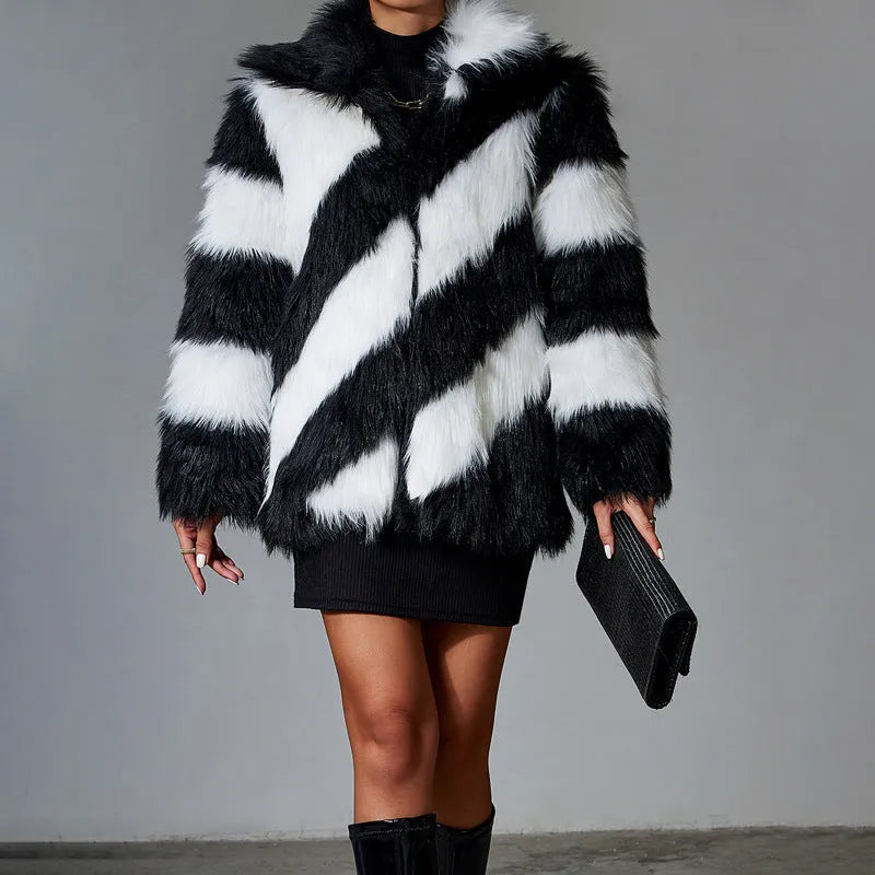Minimalist women's faux fur coat with contrast colour lapel and a detachable fur collar.