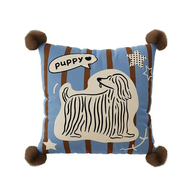 Blue cartoon animal print sofa cushion pillow on a grey sofa.