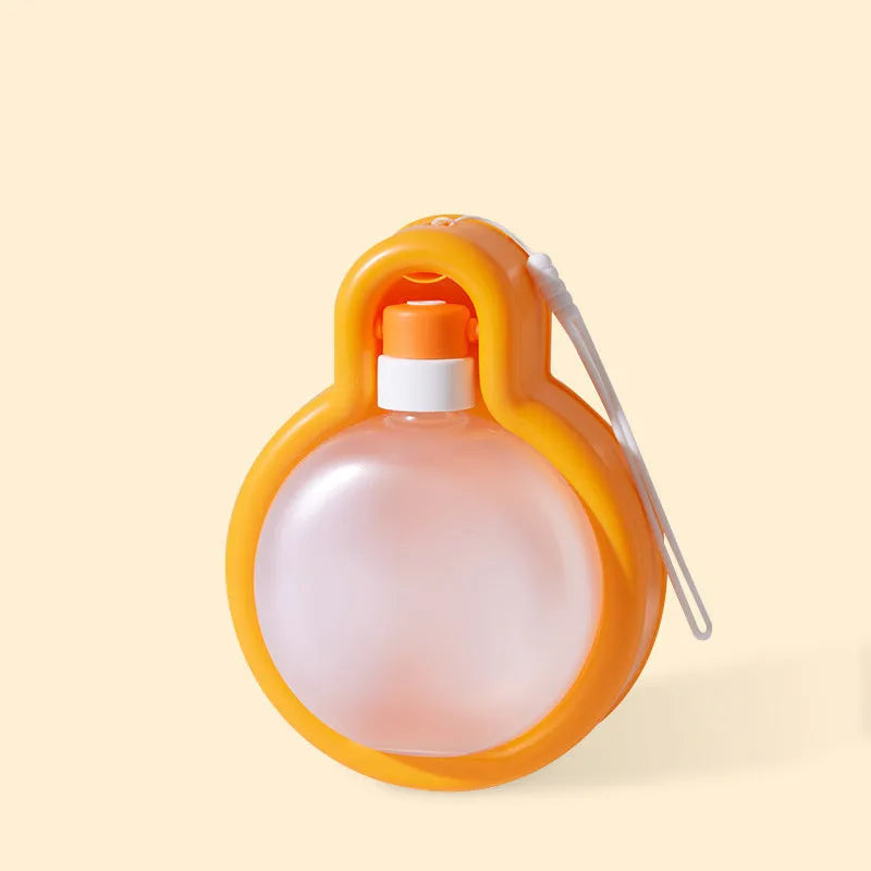 Green dog travel water bottle with integrated drinking bowl for outdoor use