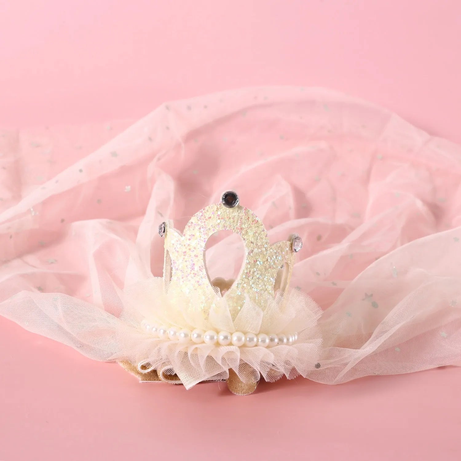 Cat wearing princess crown headdress with lace veil in beige or pink