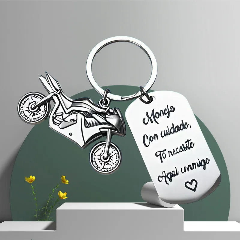 Stainless steel motorcycle key chain with inspirational design and included flannel storage bag