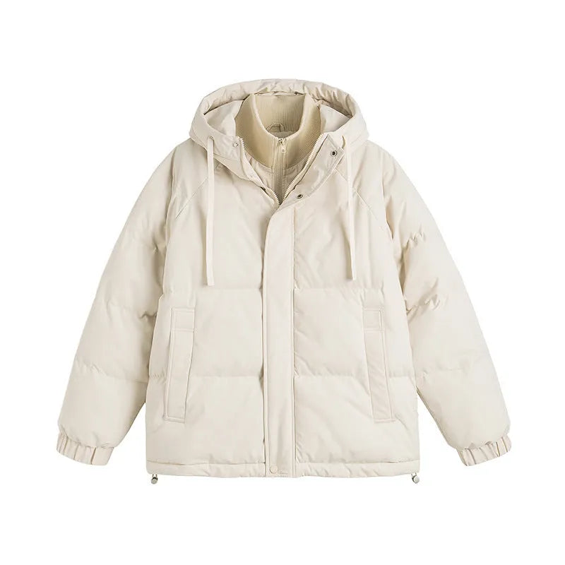 Loose beige cotton-padded jacket with side seam pockets on a hanger