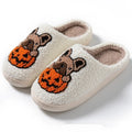 Black and white Halloween slippers with pumpkin patterns and plush fabric construction