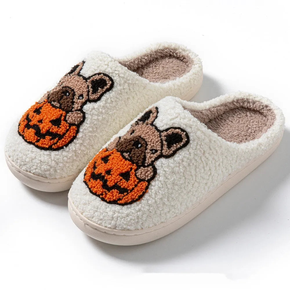 Black and white Halloween slippers with pumpkin patterns and plush fabric construction