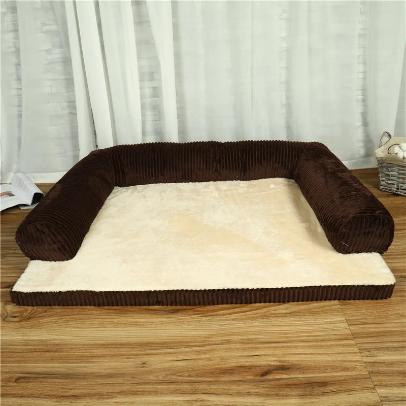 Corduroy dog sofa bed in grey, showing high sides and non-slip base, placed on a wooden floor.