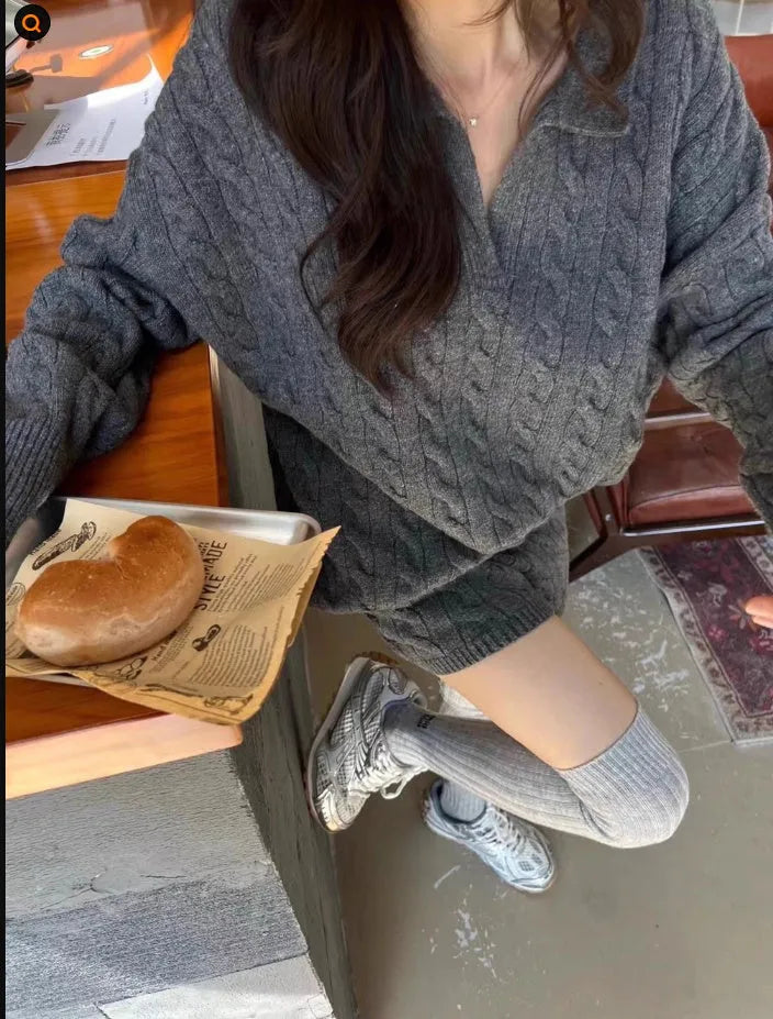 Women's creamy-white cable knit suit set with long sleeve jumper and elastic waist shorts.
