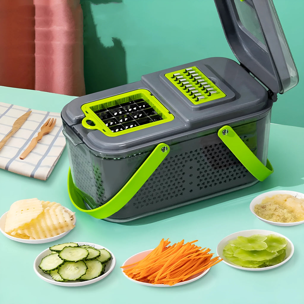 Grey multifunctional vegetable cutter with stainless steel blades, foldable compartments, and a large container on a kitchen counter