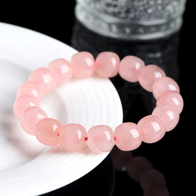 Pink crystal barrel bead bracelet with geometric design and 8 x 10mm bead sizing