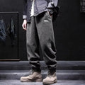 Grey men's straight leg sweatpants with an ankle strap tie detail