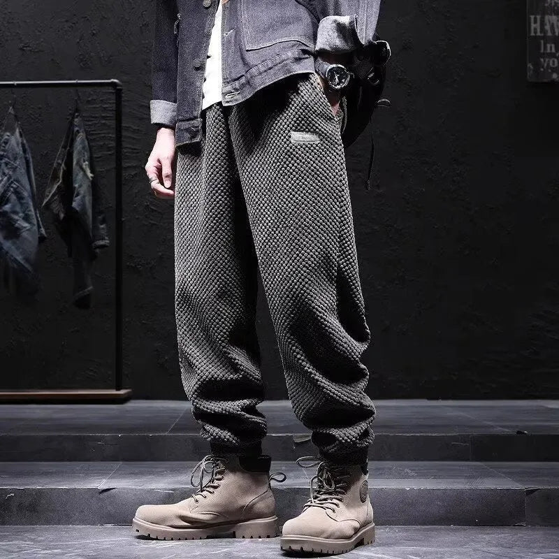Grey men's straight leg sweatpants with an ankle strap tie detail