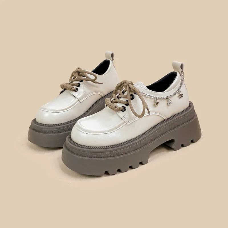 White Amy And Mai PU leather Mary Jane platform shoes with chunky heel and lace-up front.