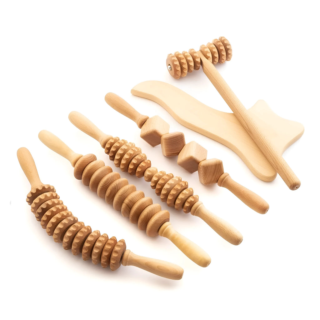 A set of natural beech wood massage rollers including T-shaped and multi-wheel tools for muscle relief.