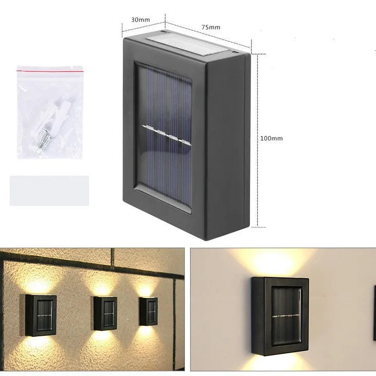 Solar garden wall light with upward and downward LED illumination for outdoor decorative lighting
