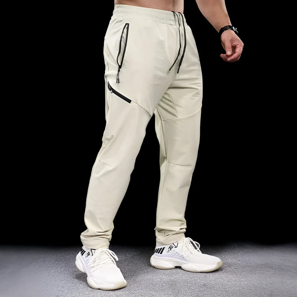Men's waterproof quick-drying nylon workout trousers in Army Green colour showing mid waist design