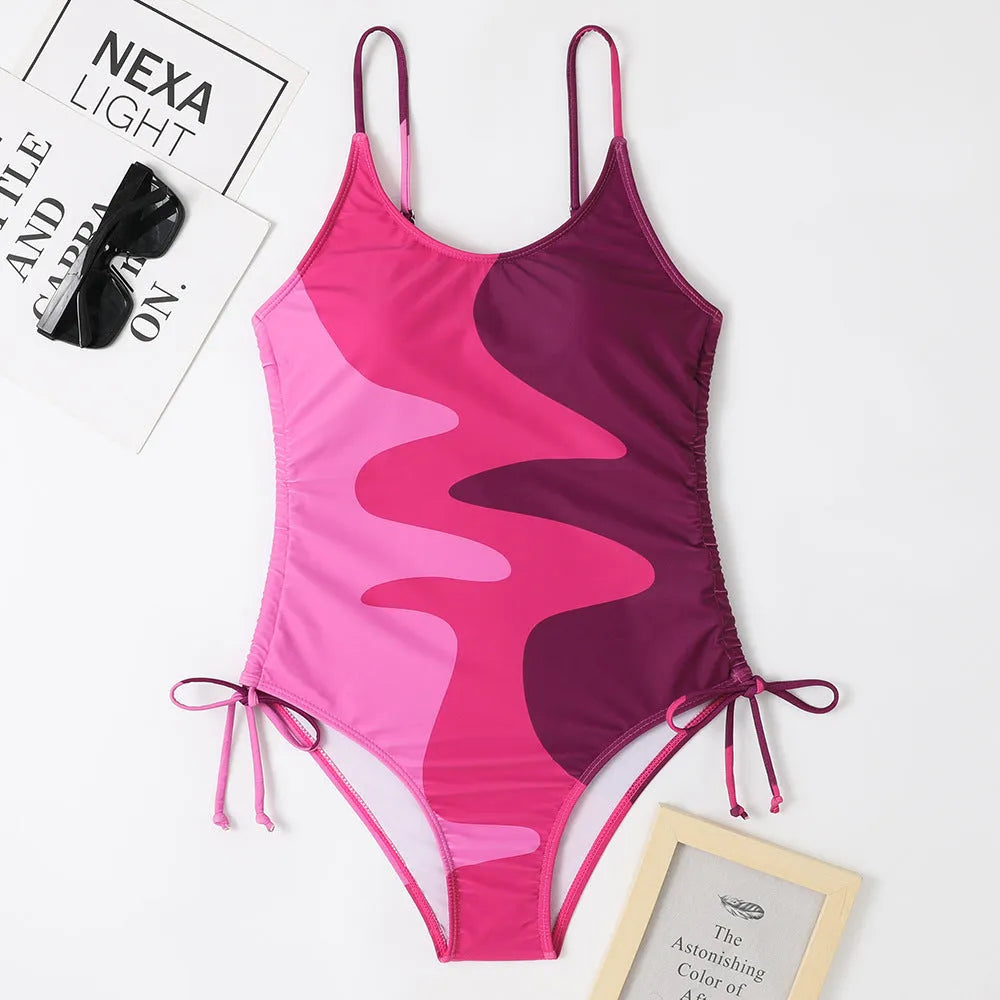 Women's sleeveless one-piece swimsuit in blue colour with backless design for swimming sports