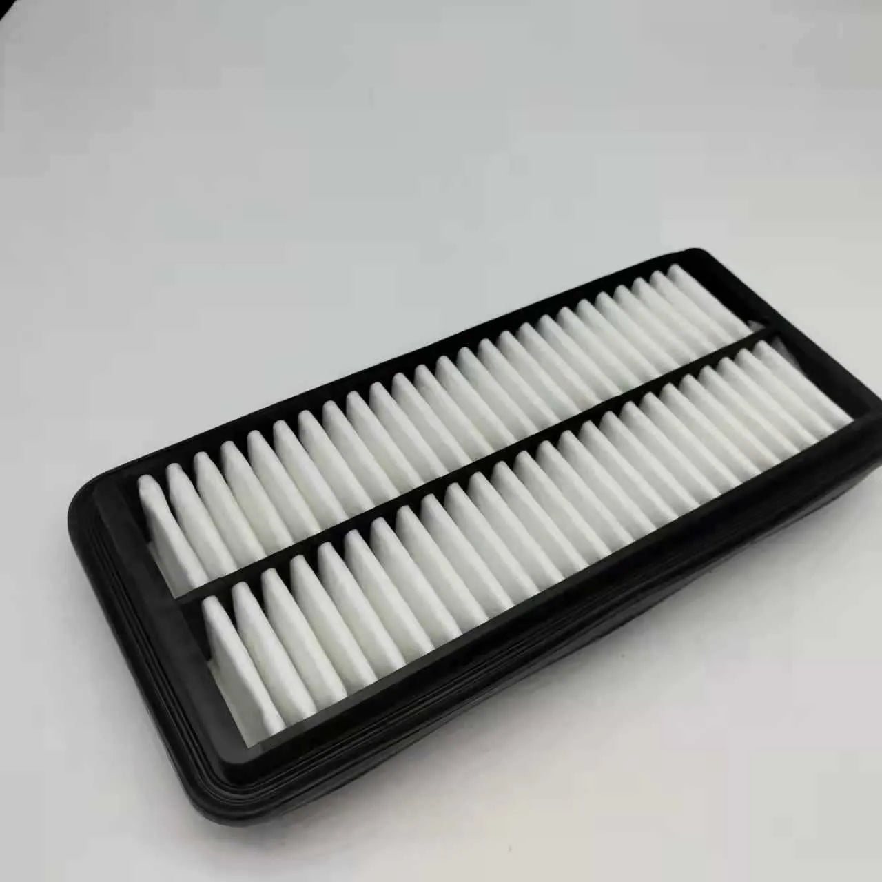 Black car air filter measuring 256x113x40mm for modern vehicle replacement