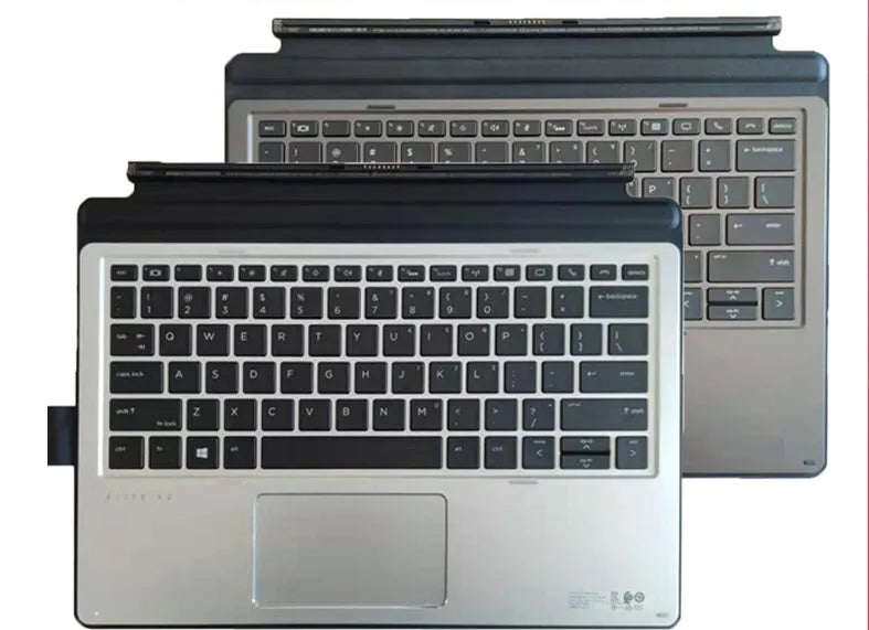 Wireless tablet keyboard on a desk next to an Elite X2 tablet, showing multimedia keys.