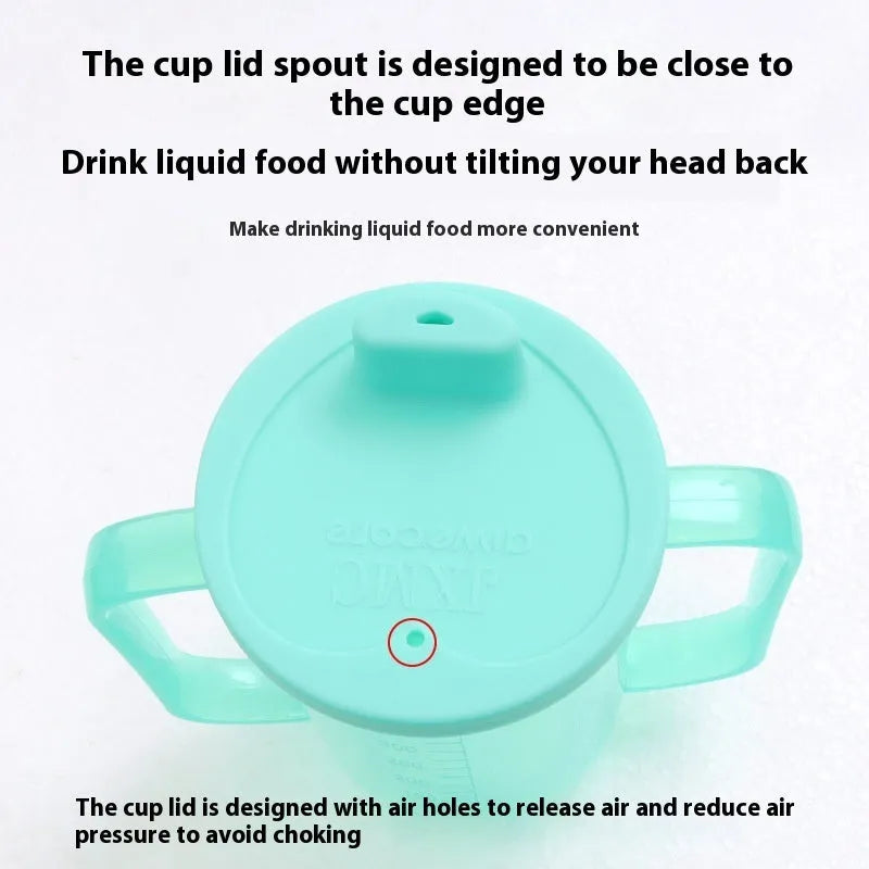 Adult bedside drinking cup with angled choke-proof mouth, handle, and lid, shown in care setting.