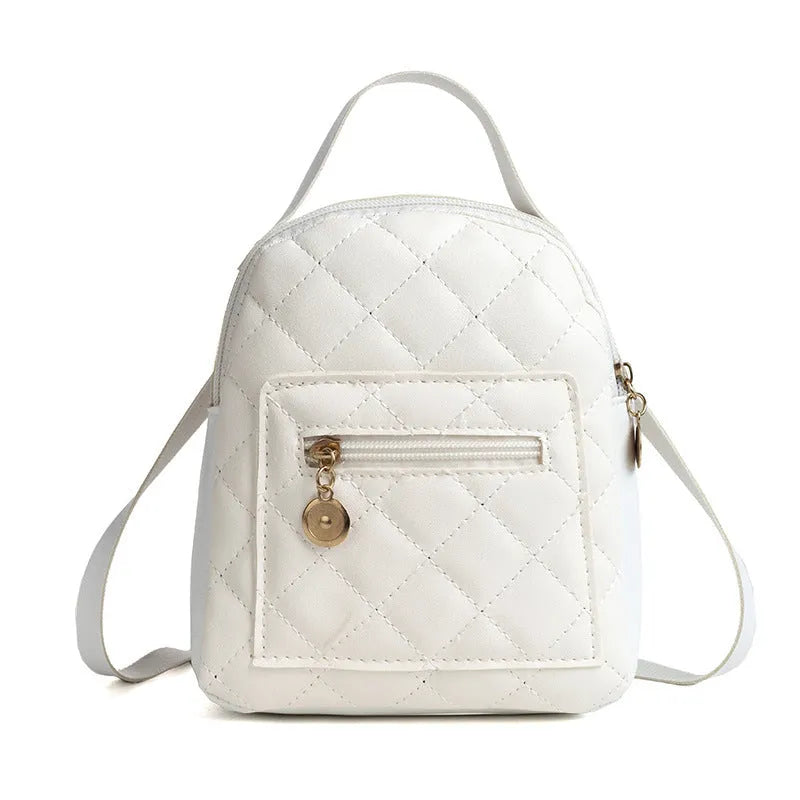 Girls' hard-shell vertical square backpack with embroidery in pink, showing front view and soft carry handle.