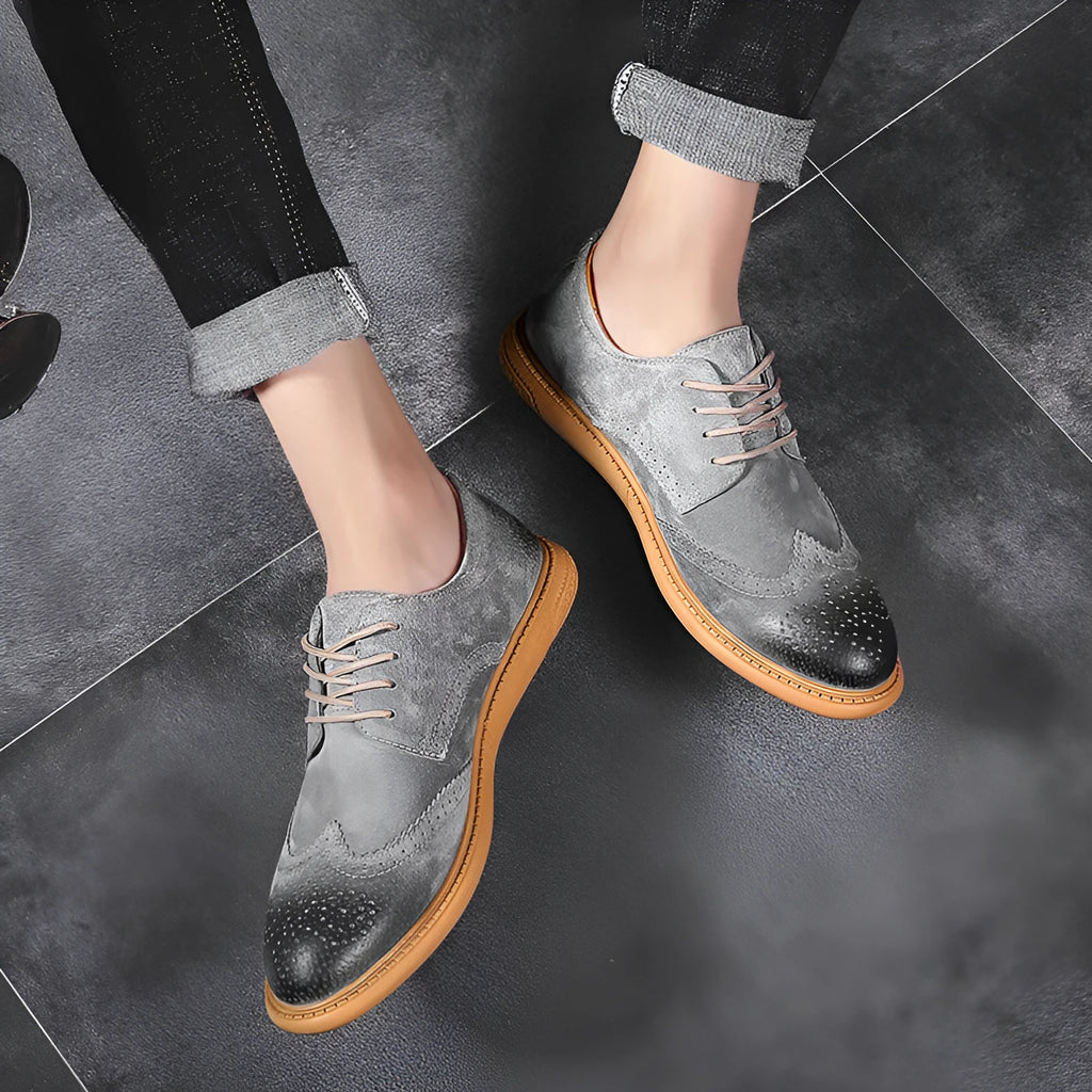 Men's grey low-top leather business shoes with lace-up design and non-slip rubber sole.