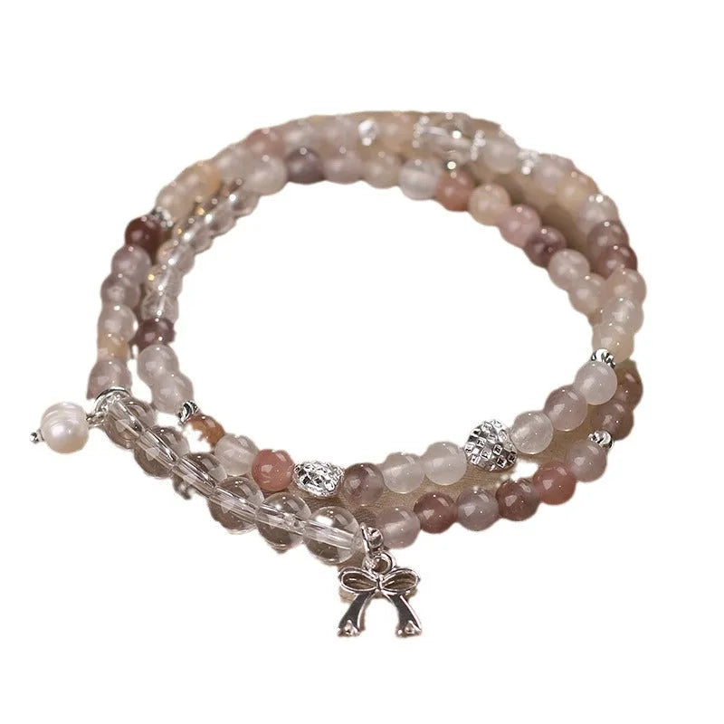 Chinese ancient style beaded butterfly bracelet on woman's wrist