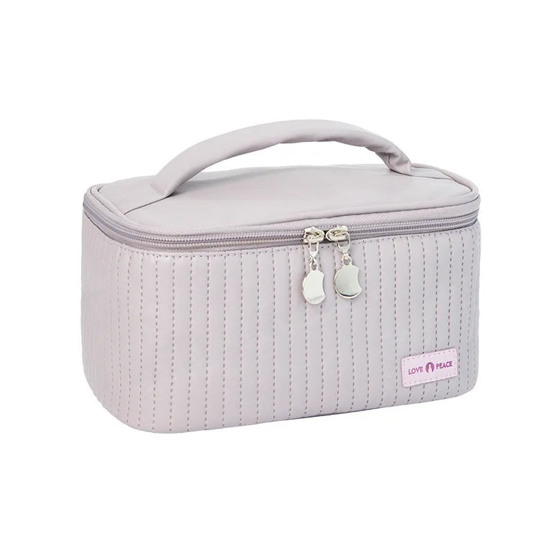 Open-top cake-shaped women's makeup bag in PU leather, shown in a choice of six solid colours.