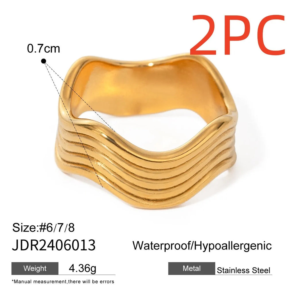 A stainless steel women's ring with a wide, geometric wave design in a Korean style.