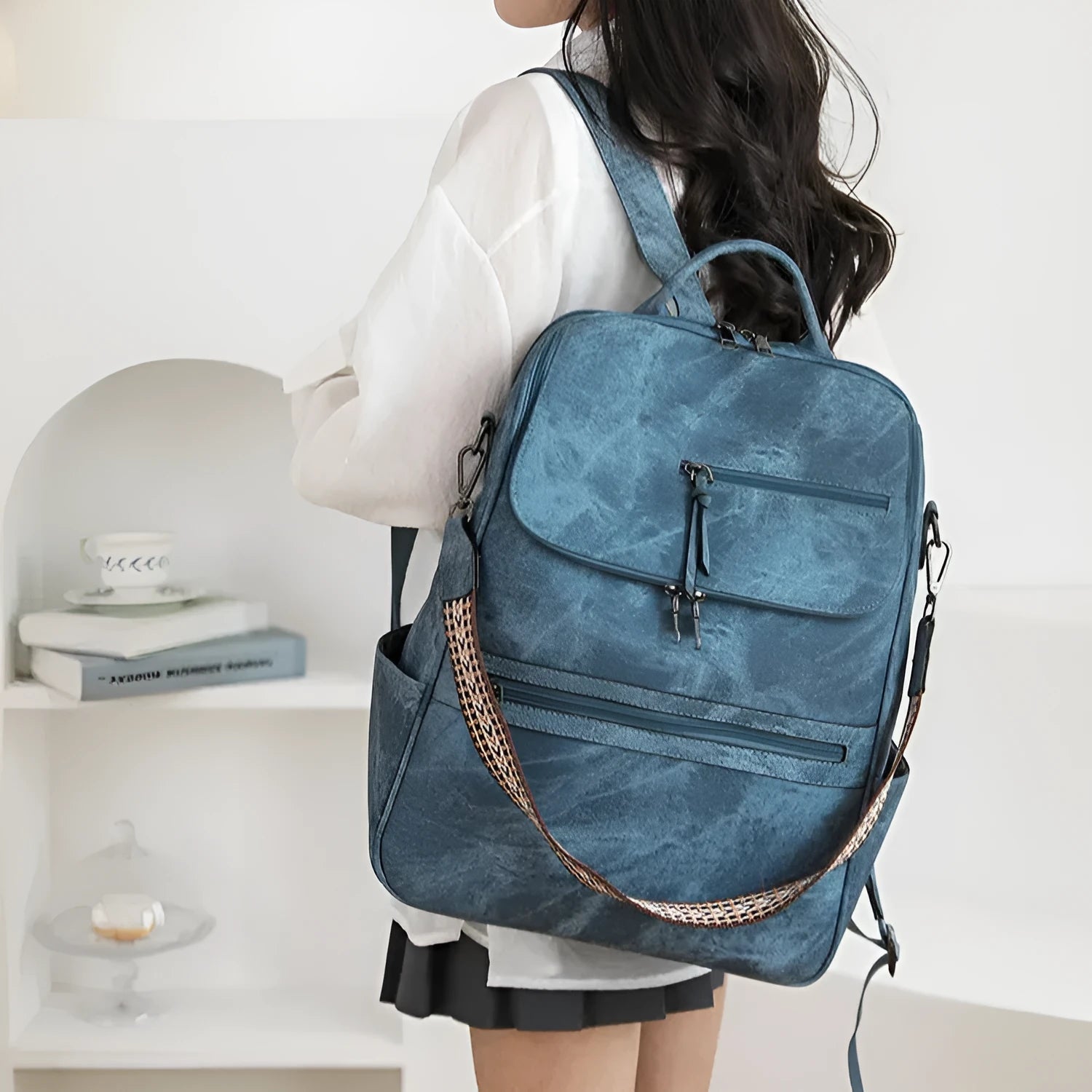 Retro college backpack in black PU leather with curved shoulder straps and stitching details