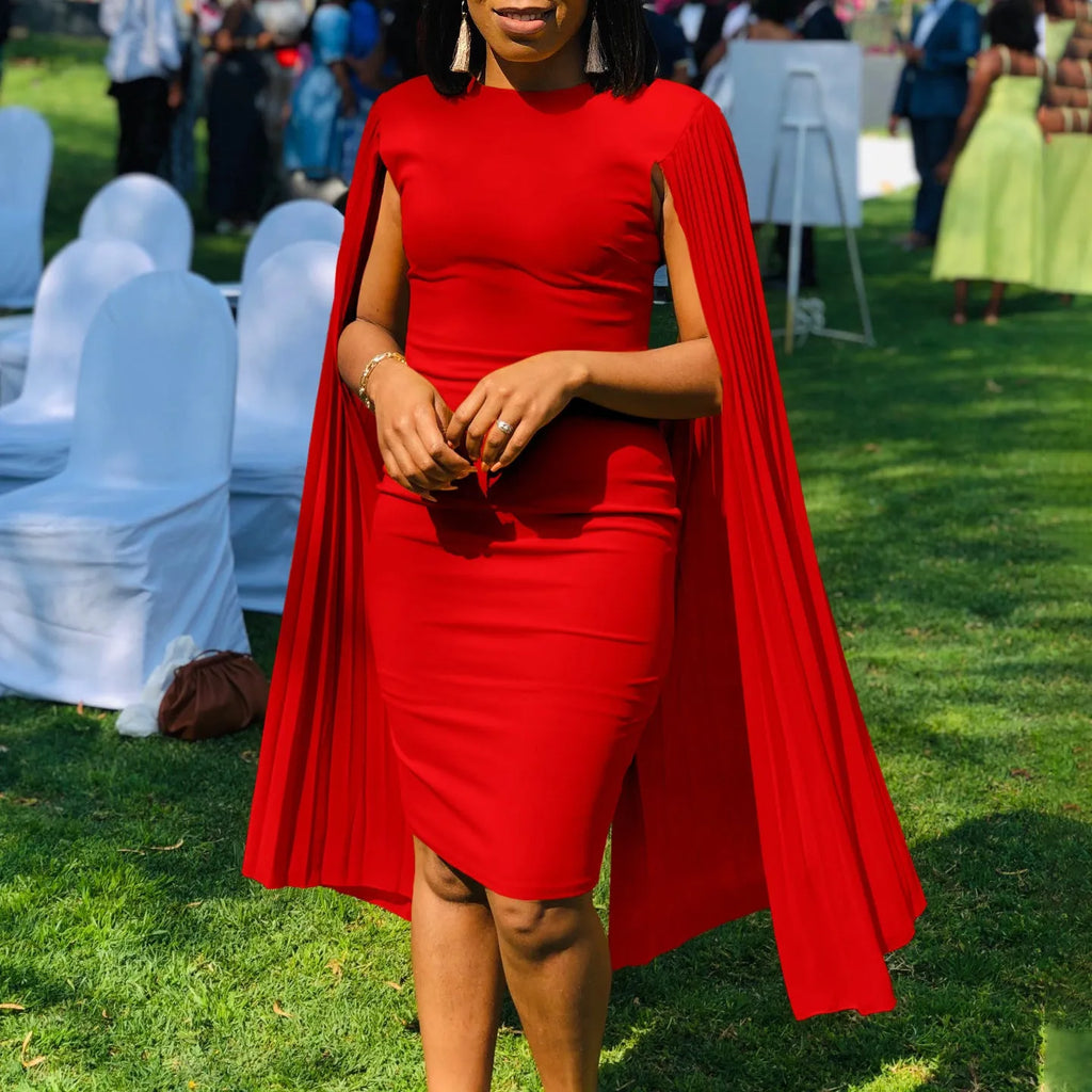 Long sleeve high waist evening gown with a round neck and pleated shawl detail.