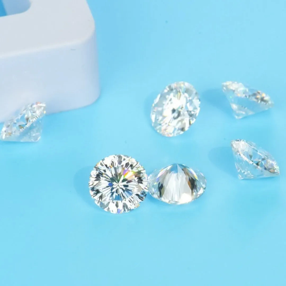Round brilliant cut moissanite gemstone showing eight hearts and eight arrows pattern on a neutral background.