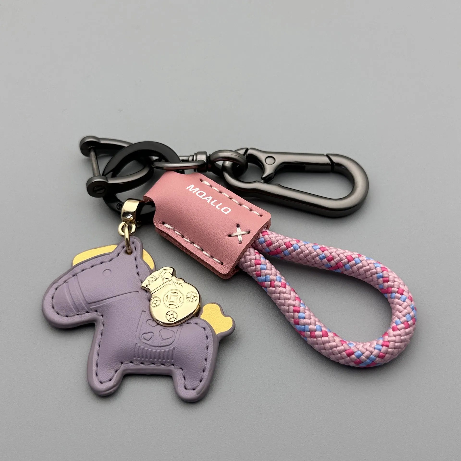 Handmade brown cowhide car key pendant with green flanelle rope and a metal buckle.