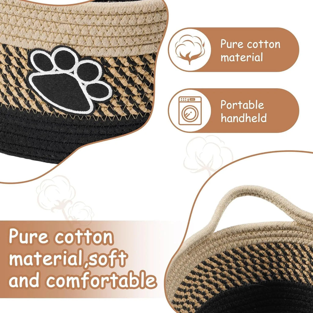 Small light beige handwoven cotton rope storage basket with a wooden handle.