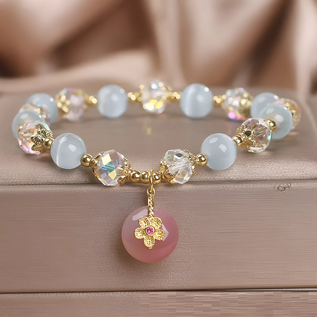 Chinese style sky blue opal peace buckle pendant bracelet for women on a flat surface