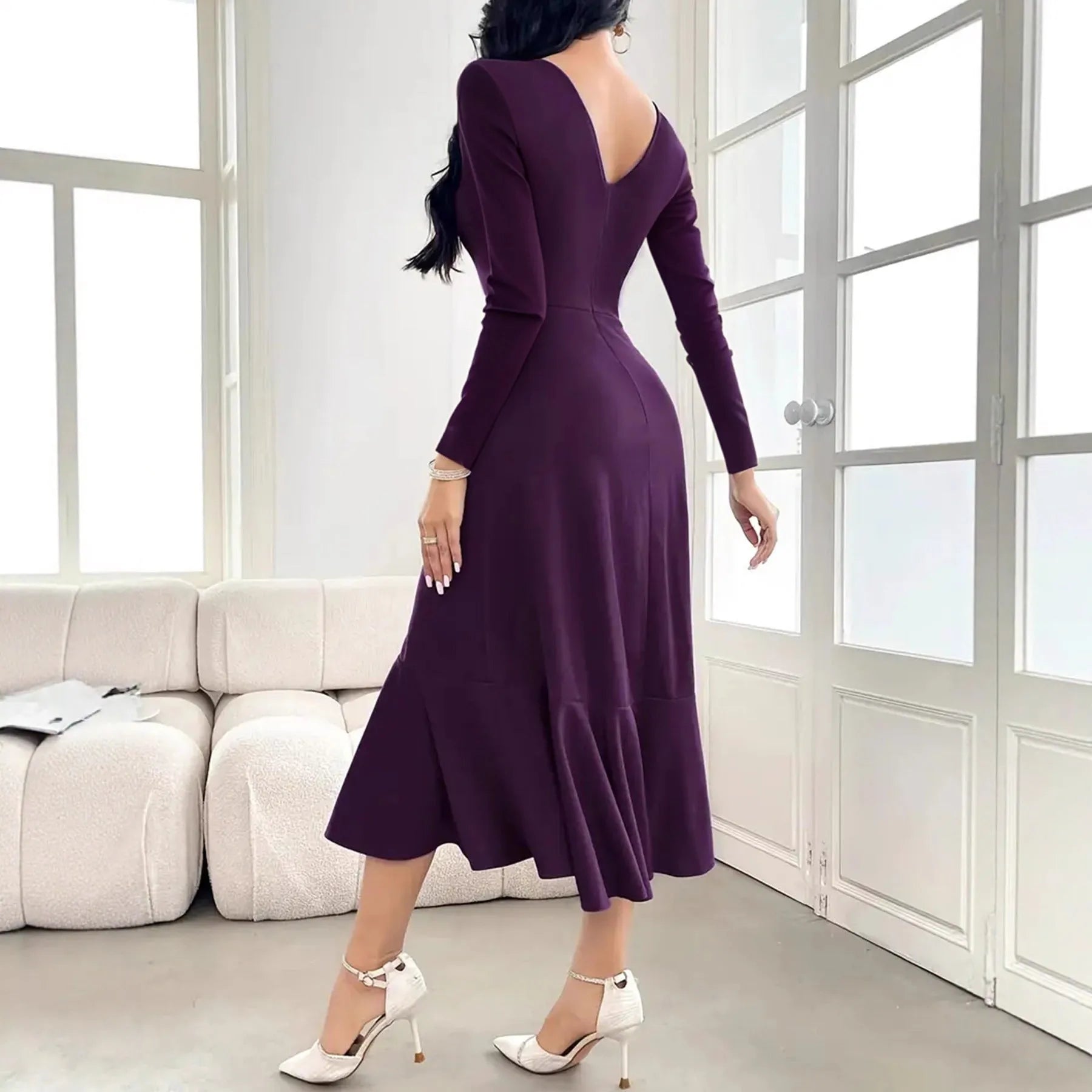 Purple women's long sleeve pullover dress with round neck and ruffle details on a mid waist.