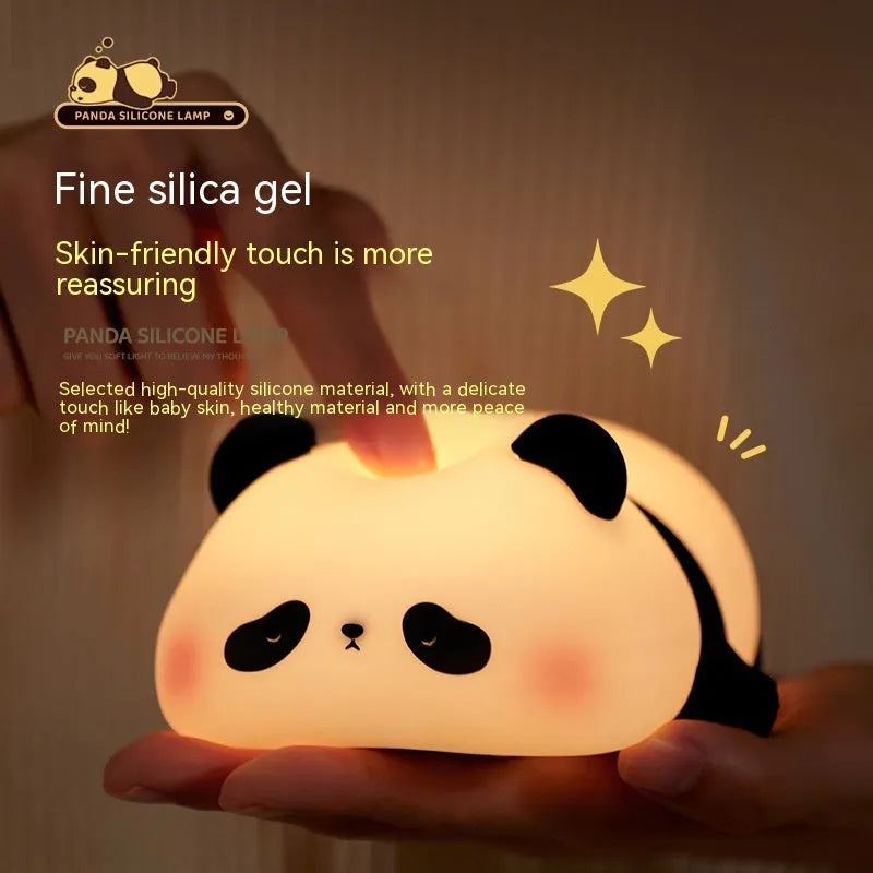 White panda-shaped night light with black accents measuring 150mm tall with USB charging port