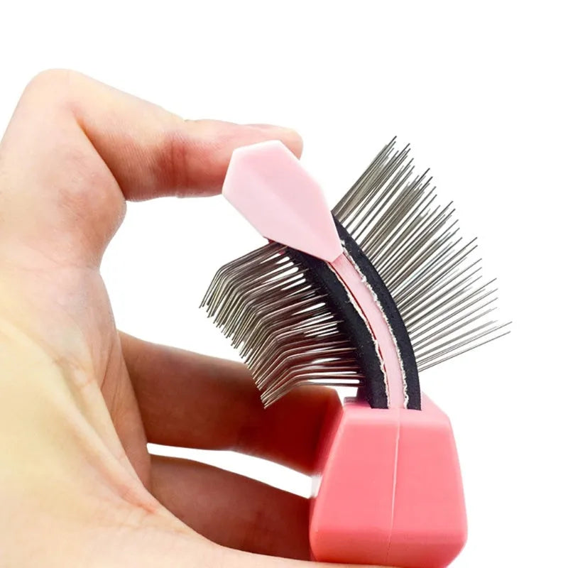 Double-sided pet brush showing stainless steel pins on one side and soft bristles on the other, with blue handle.