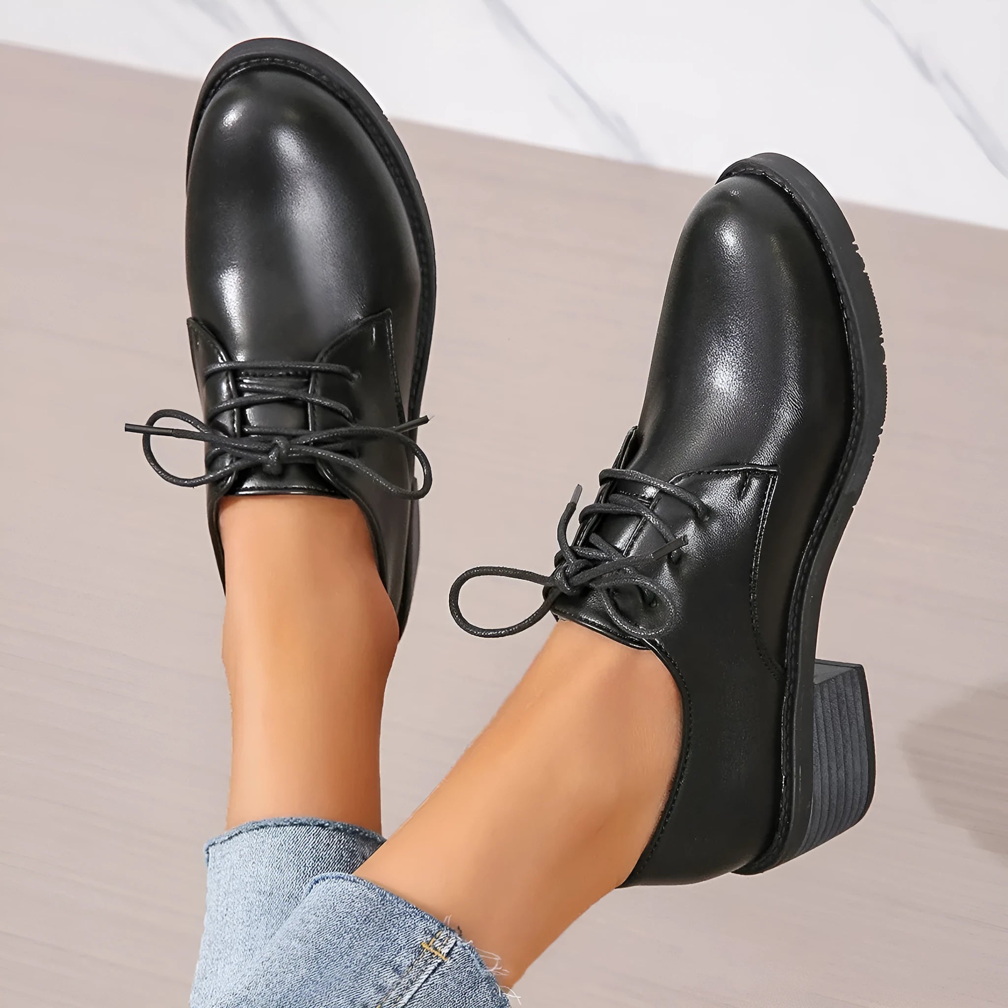 Black women's chunky heel ankle boots with rubber sole and professional styling