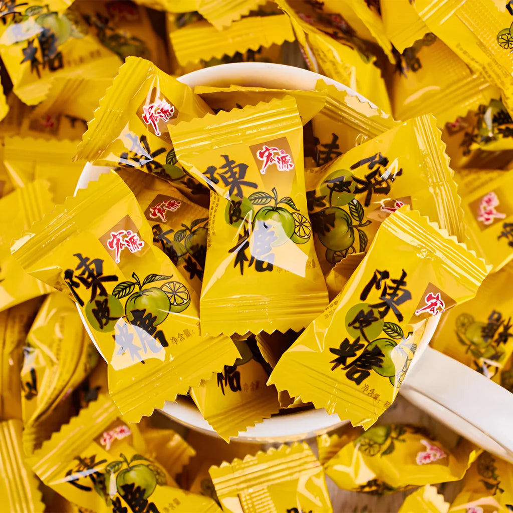 Three bags of hard candy: plum sugar, guava and tangerine peel flavours in 350g and 355g sizes