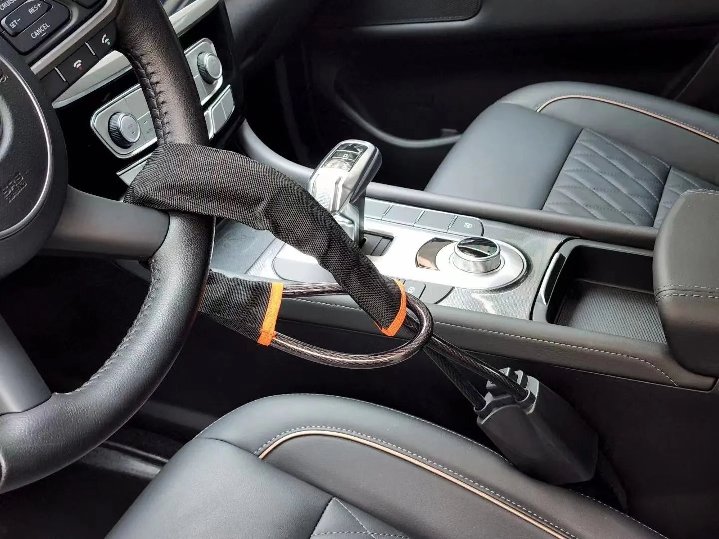 Red iron steering wheel lock with cable design for General Motors cars showing 33cm size